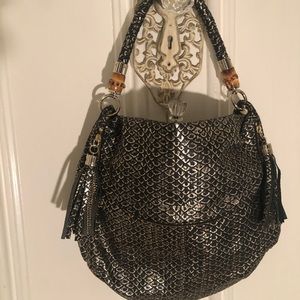 Black and gold couture leather handbag